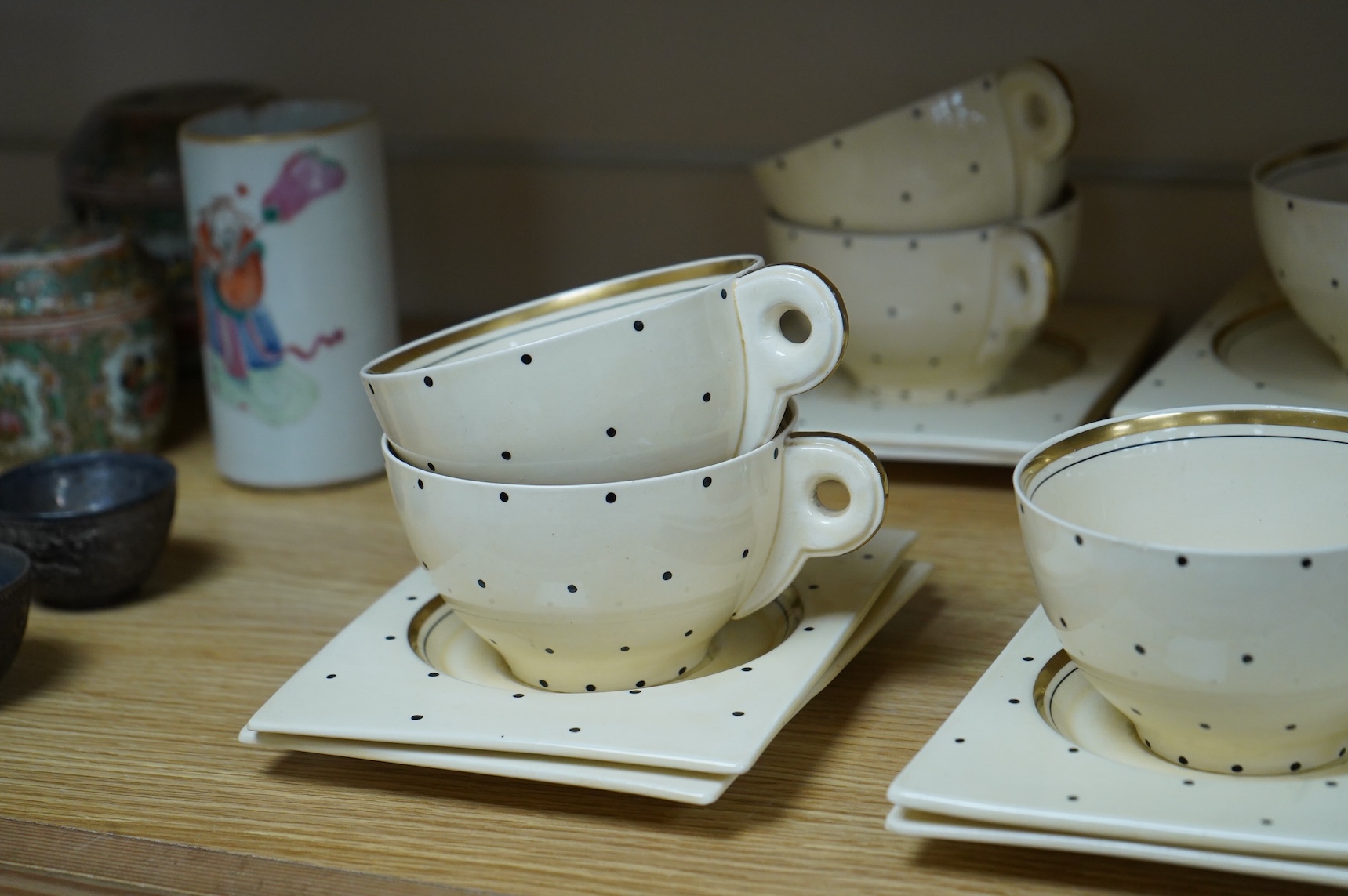 A Clarice Cliff Biarritz-shape 21-piece part teaset including trencher plates and saucers, impressed date-code 1935, jug 13cm